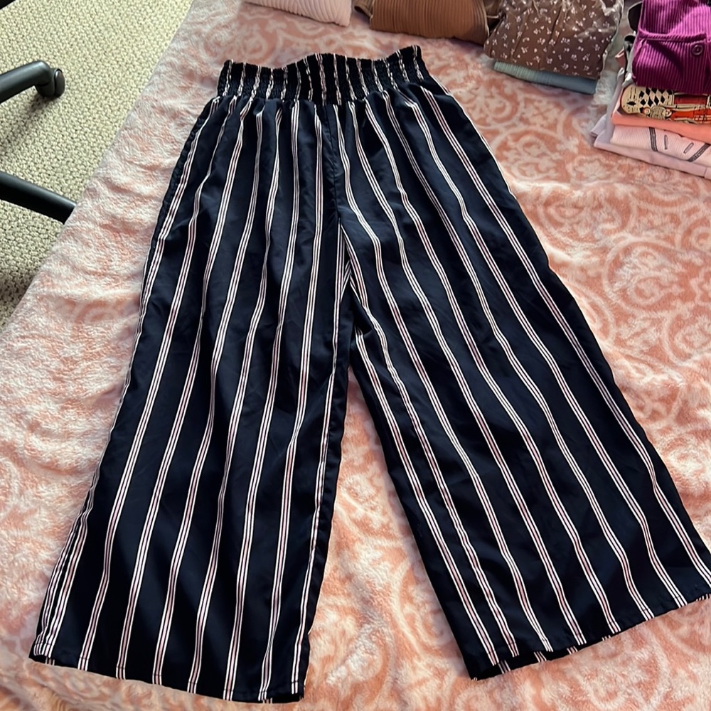 flowy navy blue and pink pants worn